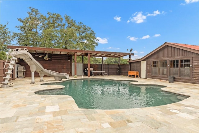206 22 Hills Rd, Gause, TX 77857 - view of swimming pool with a water slide and a patio