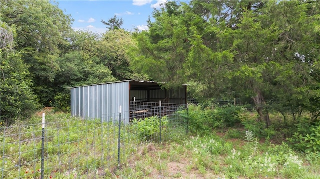 206 22 Hills Rd, Gause, TX 77857 - view of pole building with a wooded view