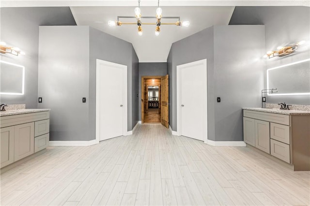 206 22 Hills Rd, Gause, TX 77857 - bathroom featuring wood finished floors and two vanities