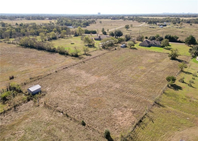 birds eye view of property featuring a rural view