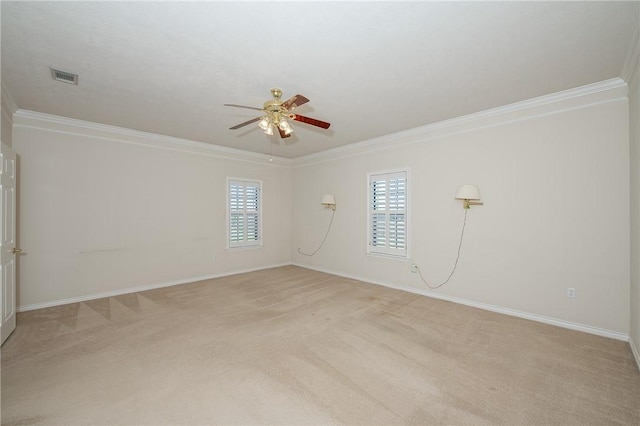 carpeted empty room with ceiling fan and ornamental molding