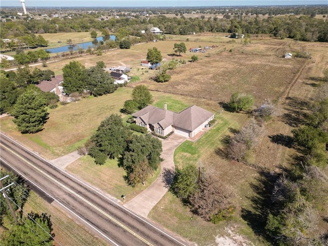 birds eye view of property with a rural view and a water view