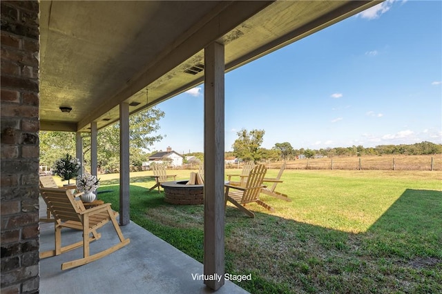 view of yard with an outdoor fire pit