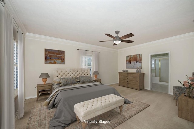 bedroom featuring light colored carpet, ensuite bath, ceiling fan, and ornamental molding