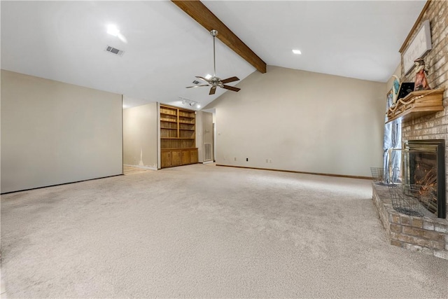 unfurnished living room featuring visible vents, a ceiling fan, light colored carpet, a brick fireplace, and beam ceiling