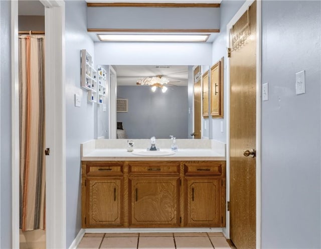 bathroom with ceiling fan, tile patterned flooring, and vanity