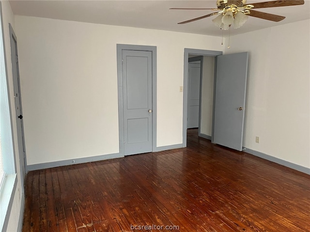 unfurnished bedroom with dark hardwood / wood-style floors and ceiling fan