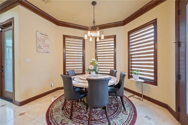 dining area with light tile patterned floors, baseboards, an inviting chandelier, and crown molding