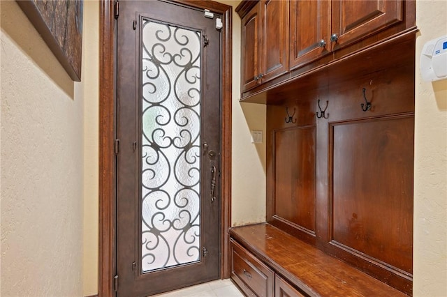 mudroom featuring a textured wall and a wealth of natural light