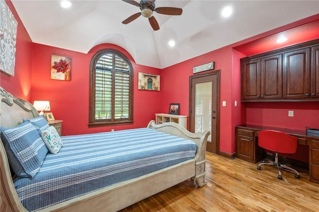 bedroom with built in desk, light wood-style flooring, ceiling fan, access to outside, and lofted ceiling