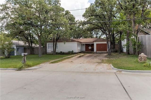 single story home with a garage and a front yard