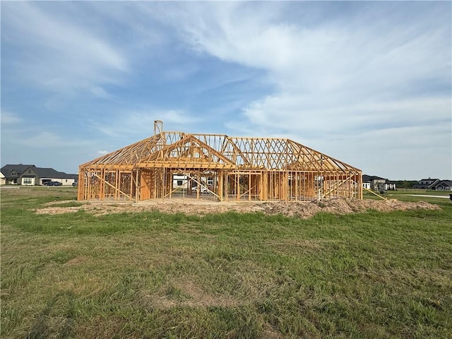 7823 Luke Ct, Bryan, TX 77808 - rear view of house featuring a lawn