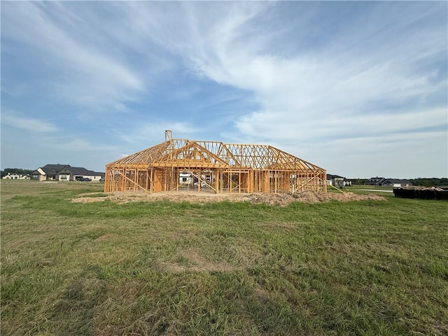 7823 Luke Ct, Bryan, TX 77808 - back of house with a lawn, a barn, and an outdoor structure