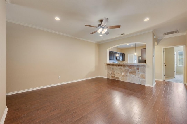 3314 Airborne Ave, College Station, TX 77845 - unfurnished living room with dark wood-style flooring, ceiling fan, baseboards, crown molding, and arched walkways