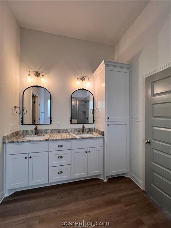 bathroom featuring vanity and hardwood / wood-style flooring