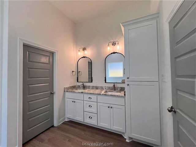 bathroom with vanity and hardwood / wood-style flooring