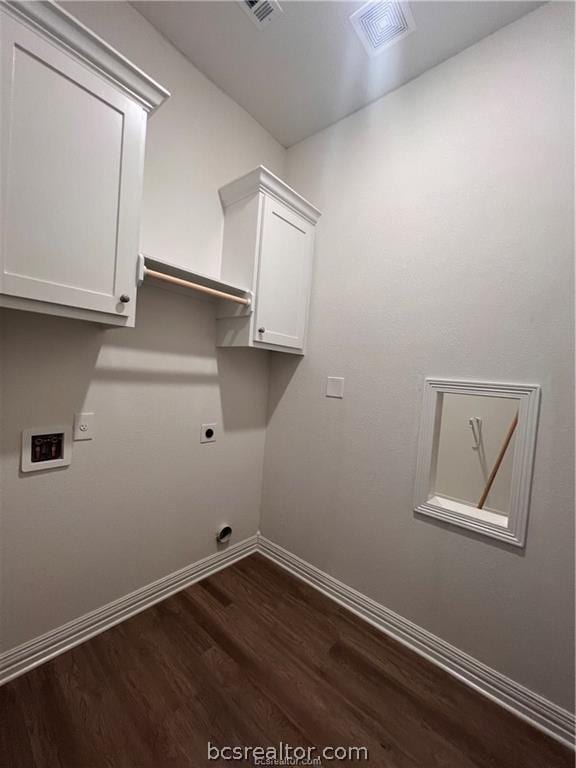 washroom featuring cabinets, hookup for a washing machine, dark hardwood / wood-style floors, and electric dryer hookup