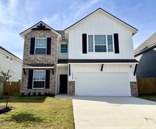 view of front facade with a front lawn and a garage