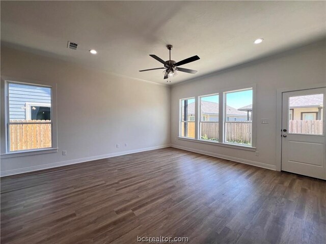 interior space featuring dark hardwood / wood-style floors, ceiling fan, and ornamental molding