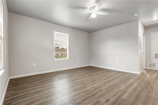 empty room featuring hardwood / wood-style flooring and ceiling fan