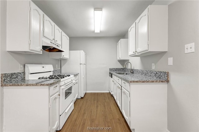 kitchen with white cabinetry, white appliances, sink, and light hardwood / wood-style flooring