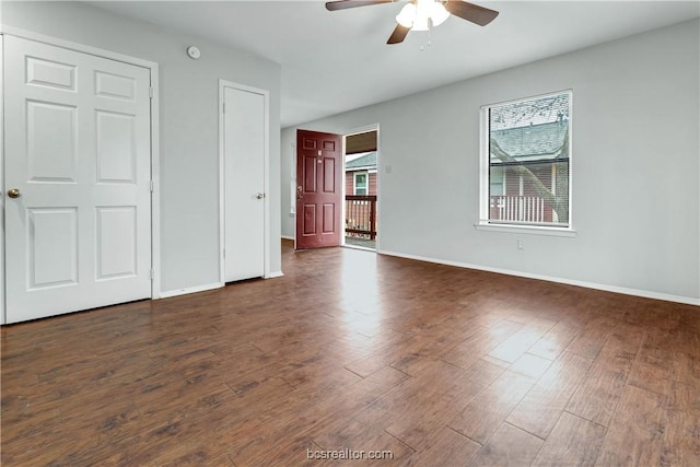 unfurnished bedroom featuring dark hardwood / wood-style floors and ceiling fan