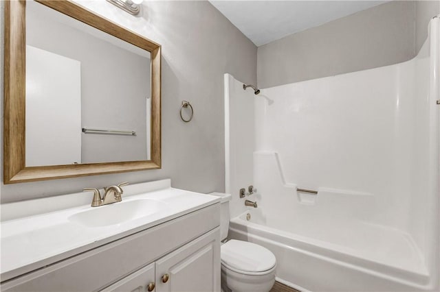 full bathroom with shower / washtub combination, vanity, and toilet