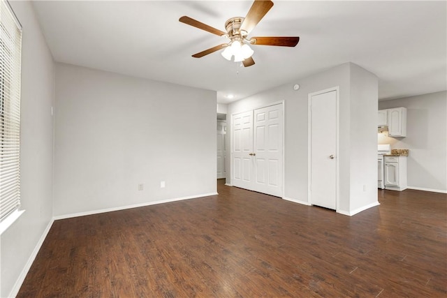 interior space featuring dark hardwood / wood-style floors and ceiling fan