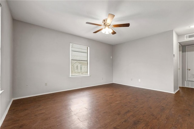 unfurnished room featuring dark wood-type flooring and ceiling fan