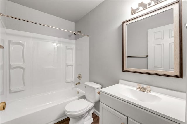 full bathroom with shower / bathing tub combination, vanity, hardwood / wood-style flooring, and toilet