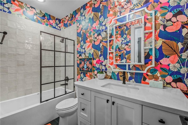 315 Suffolk Ave, College Station, TX 77840 - bathroom with shower / bath combination with glass door, toilet, vanity, and wallpapered walls
