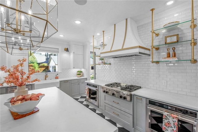 315 Suffolk Ave, College Station, TX 77840 - kitchen featuring custom exhaust hood, stainless steel appliances, a sink, light countertops, and tasteful backsplash
