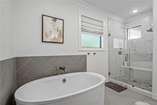 315 Suffolk Ave, College Station, TX 77840 - full bathroom with a marble finish shower, crown molding, a freestanding tub, tile patterned floors, and tile walls