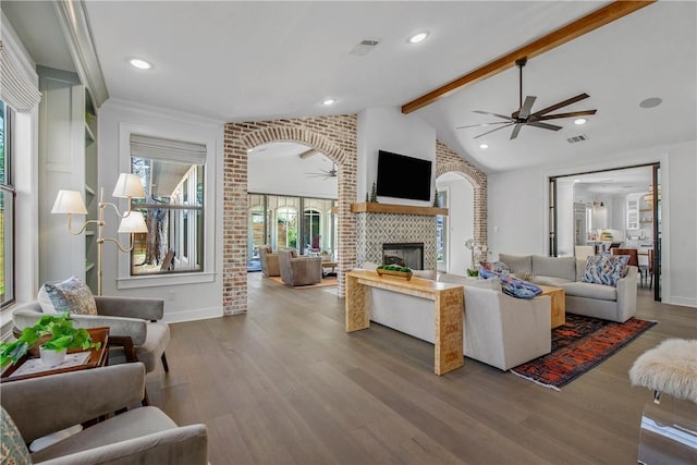 315 Suffolk Ave, College Station, TX 77840 - living room featuring visible vents, a ceiling fan, wood finished floors, a fireplace, and vaulted ceiling with beams