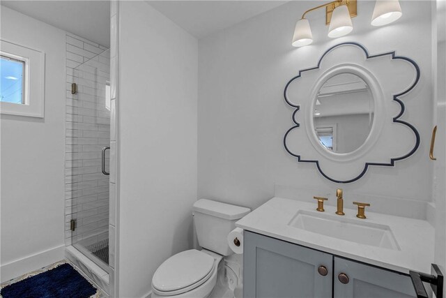 315 Suffolk Ave, College Station, TX 77840 - full bathroom featuring vanity, a shower stall, toilet, and baseboards