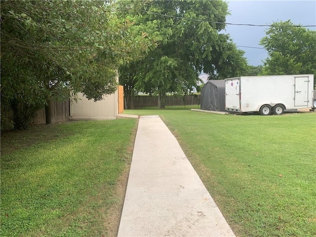 1707 Shawnee St, Navasota, TX 77868 - view of yard featuring a storage unit