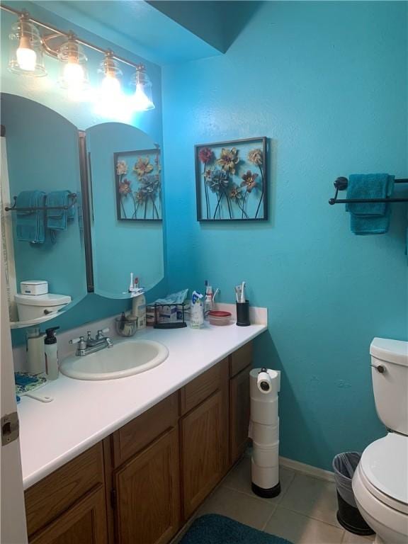 1707 Shawnee St, Navasota, TX 77868 - bathroom with tile patterned floors and vanity