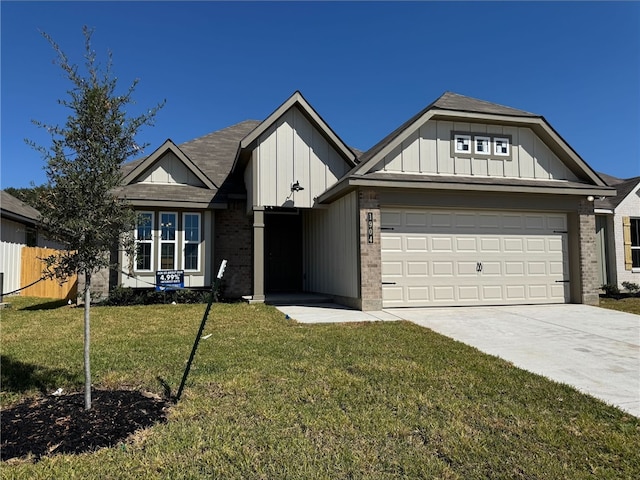 view of front of home featuring a garage and a front yard