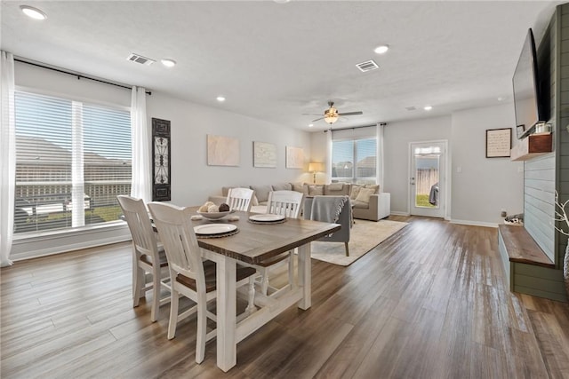 1988 Chief St, Bryan, TX 77807 - dining space featuring a fireplace, a ceiling fan, wood finished floors, baseboards, and recessed lighting