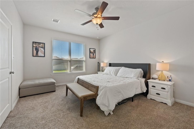 1988 Chief St, Bryan, TX 77807 - bedroom featuring light colored carpet, baseboards, and ceiling fan