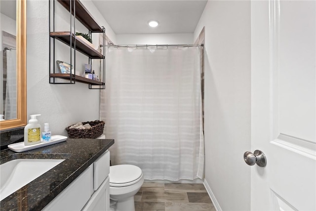 1988 Chief St, Bryan, TX 77807 - full bathroom with vanity, toilet, and a shower with shower curtain