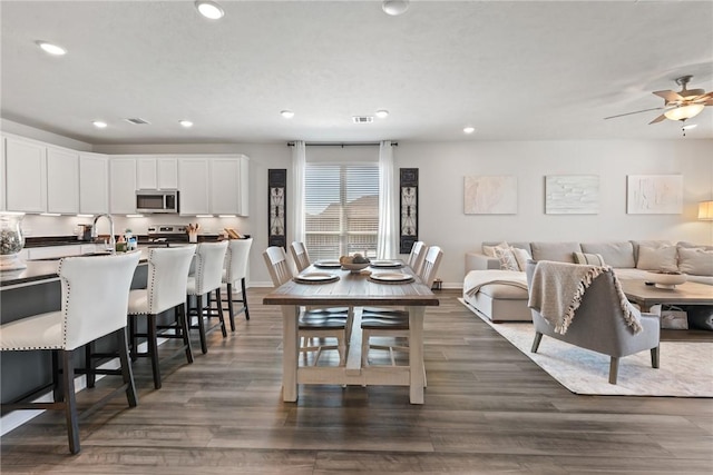 1988 Chief St, Bryan, TX 77807 - dining area featuring recessed lighting, dark wood-type flooring, a ceiling fan, and baseboards