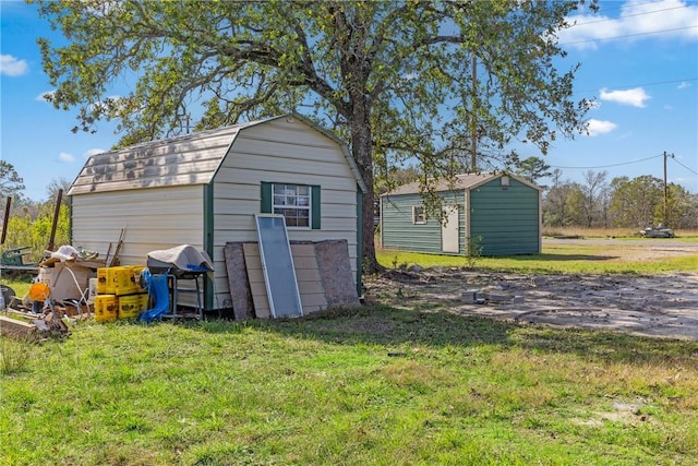 view of outdoor structure with a lawn