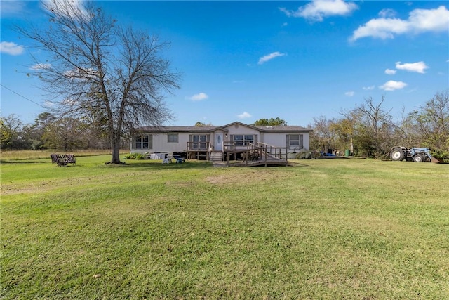 exterior space featuring a front yard and a deck