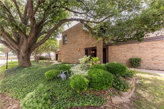 1536 Wolf Run, College Station, TX 77840 - view of property exterior featuring brick siding