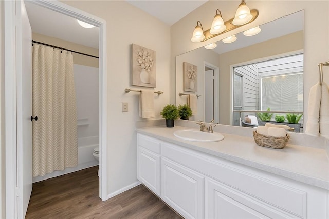1536 Wolf Run, College Station, TX 77840 - bathroom with vanity, wood finished floors, toilet, curtained shower, and baseboards