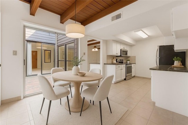 1536 Wolf Run, College Station, TX 77840 - dining space featuring wooden ceiling with exposed beams, light tile patterned floors, and baseboards