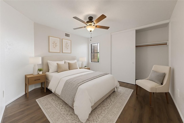 1536 Wolf Run, College Station, TX 77840 - bedroom featuring dark wood-style flooring, a closet, baseboards, and ceiling fan