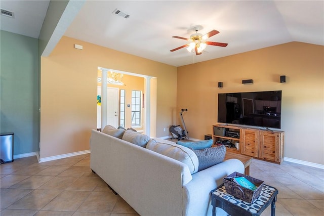 1701 Bradley Rd, College Station, TX 77845 - living area featuring a ceiling fan, light tile patterned flooring, ornate columns, baseboards, and vaulted ceiling