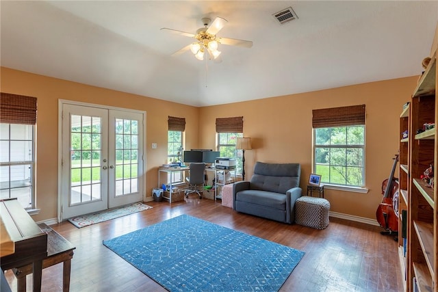 1701 Bradley Rd, College Station, TX 77845 - living area with healthy amount of natural light, a ceiling fan, wood finished floors, and french doors